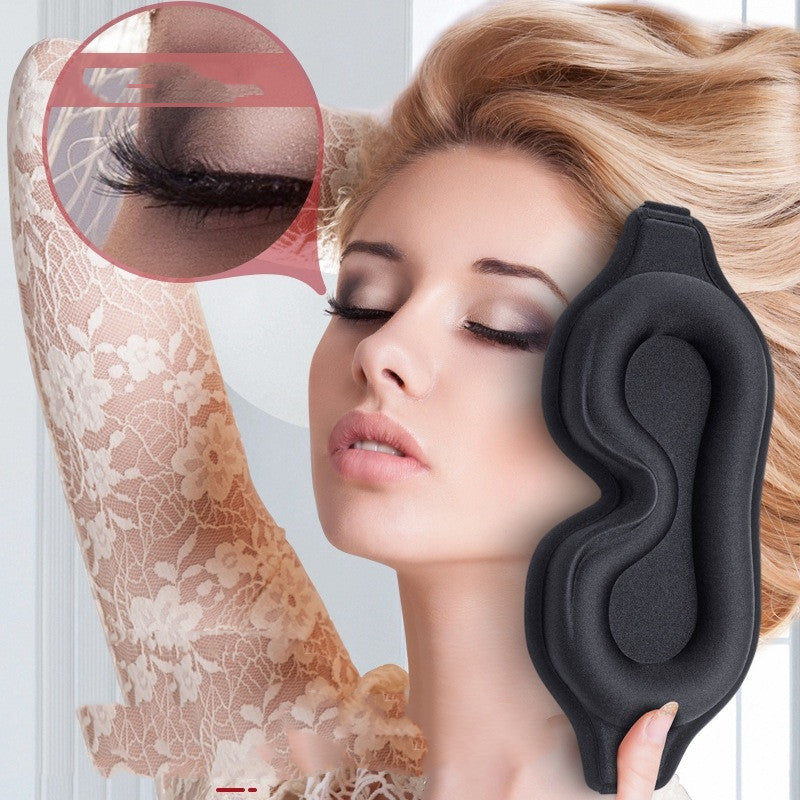 Blush pink DeepRest 3D contoured sleep mask on white bedding
